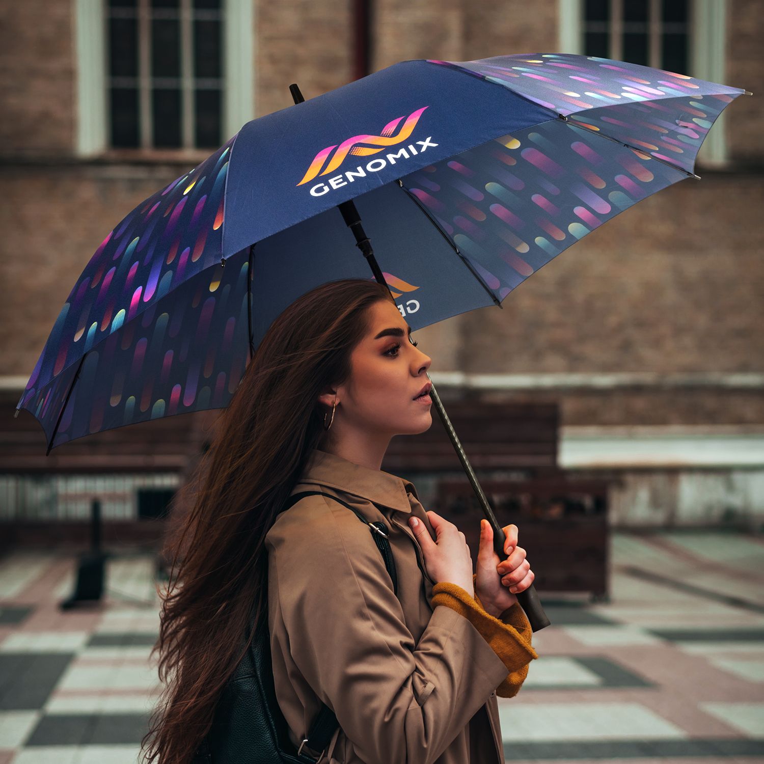 Person walking outdoors holding Full Colour umbrella with all-over custom printed canopy artwork