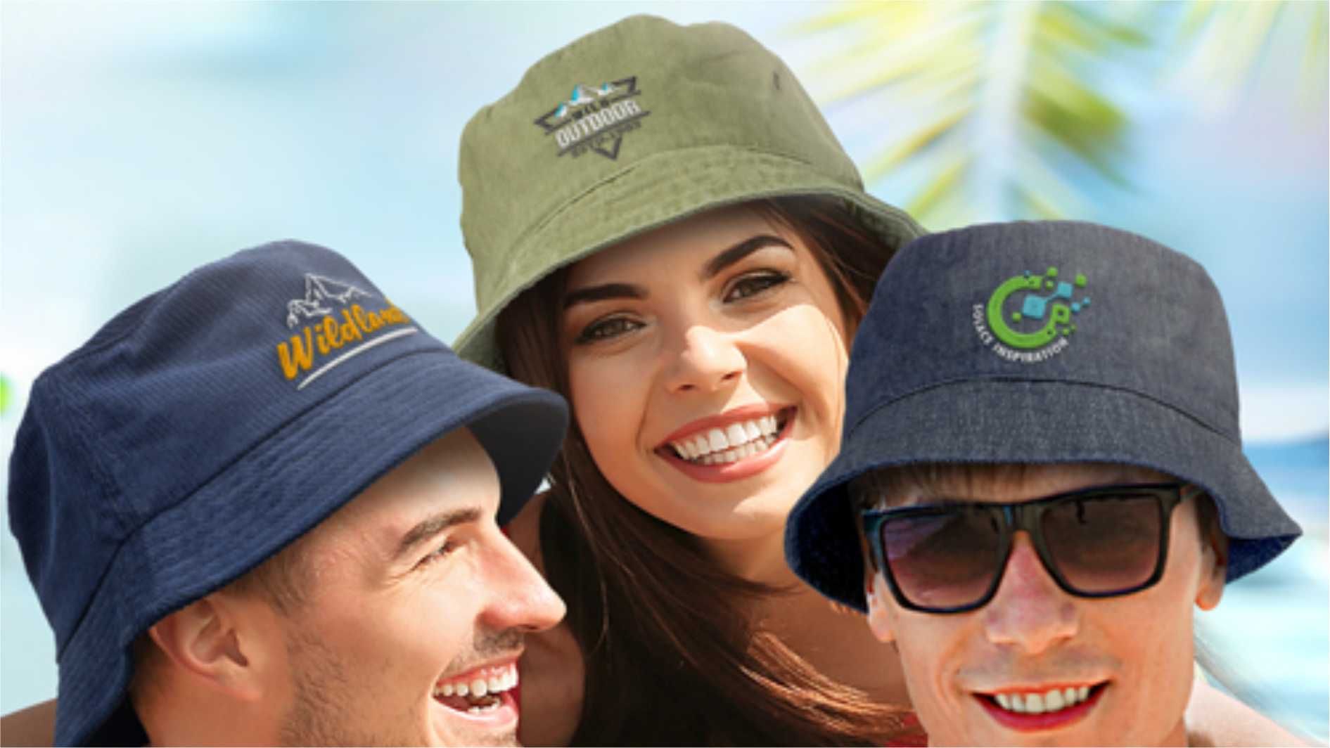 Smiling people wearing branded bucket hats in different colours outdoors.
