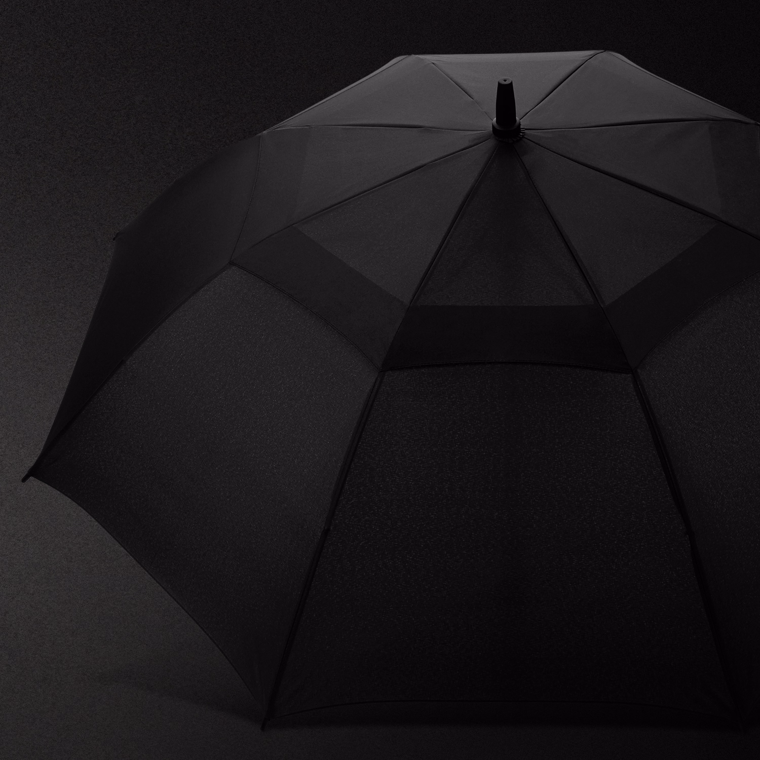 Swiss Peak Tornado 58cm Umbrella feature image showing black vented canopy against dark background