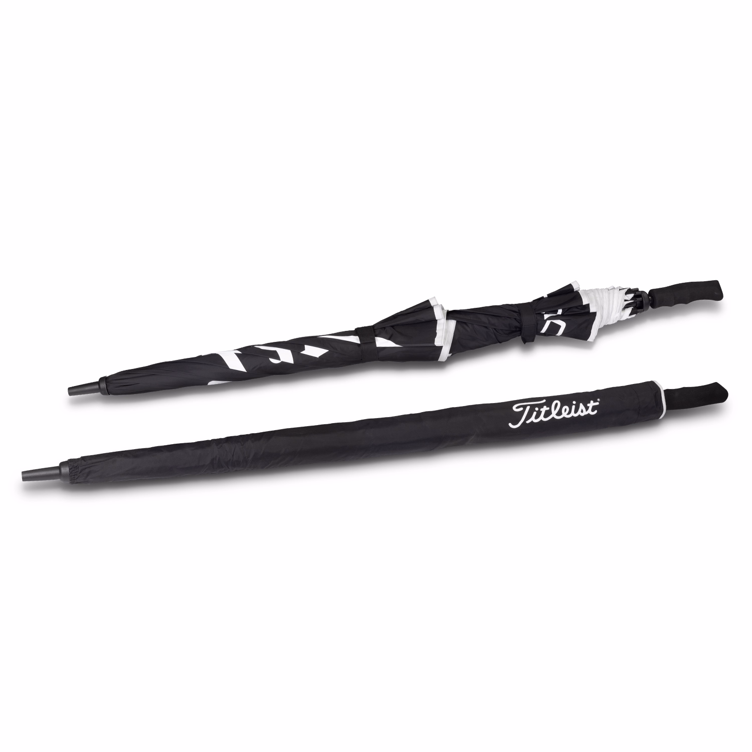 Titleist Tour Double Canopy Umbrella folded and covered, showing black sleeve with white Titleist logo and soft-grip handle