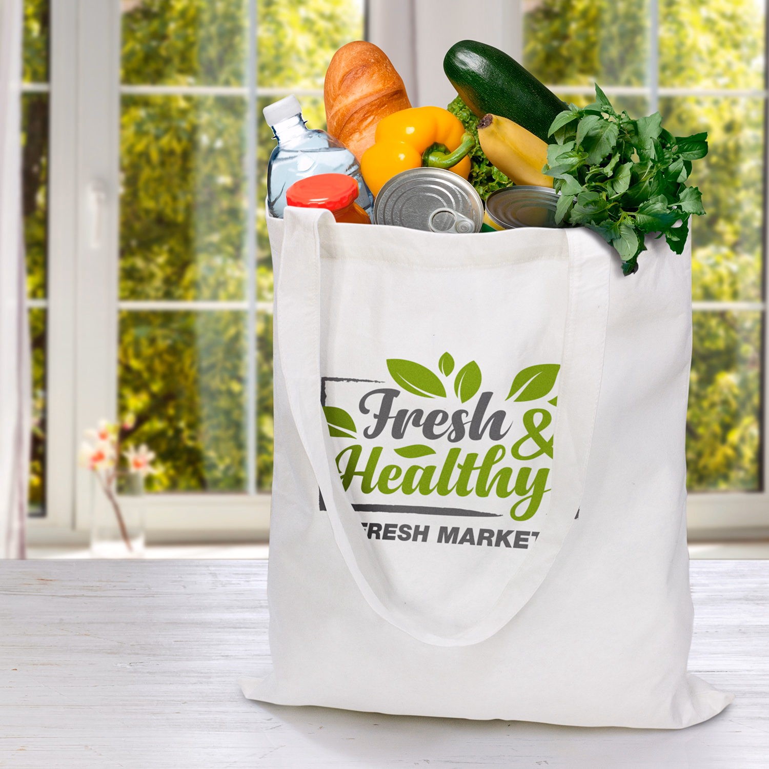Cotton tote bag with Fresh & Healthy logo filled with groceries on kitchen table.